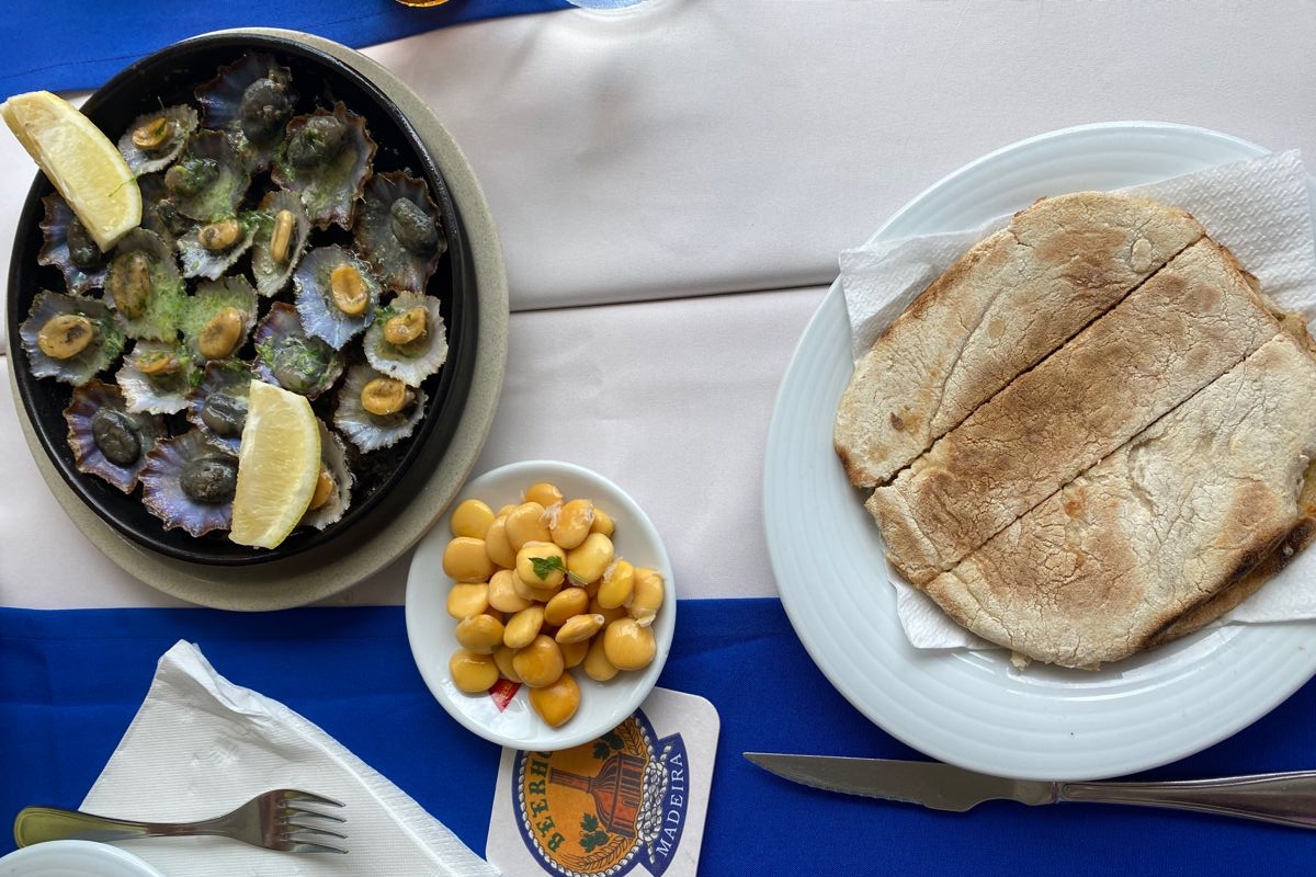 Traditional Madeiran food lapas limpets and bolo do caco bread