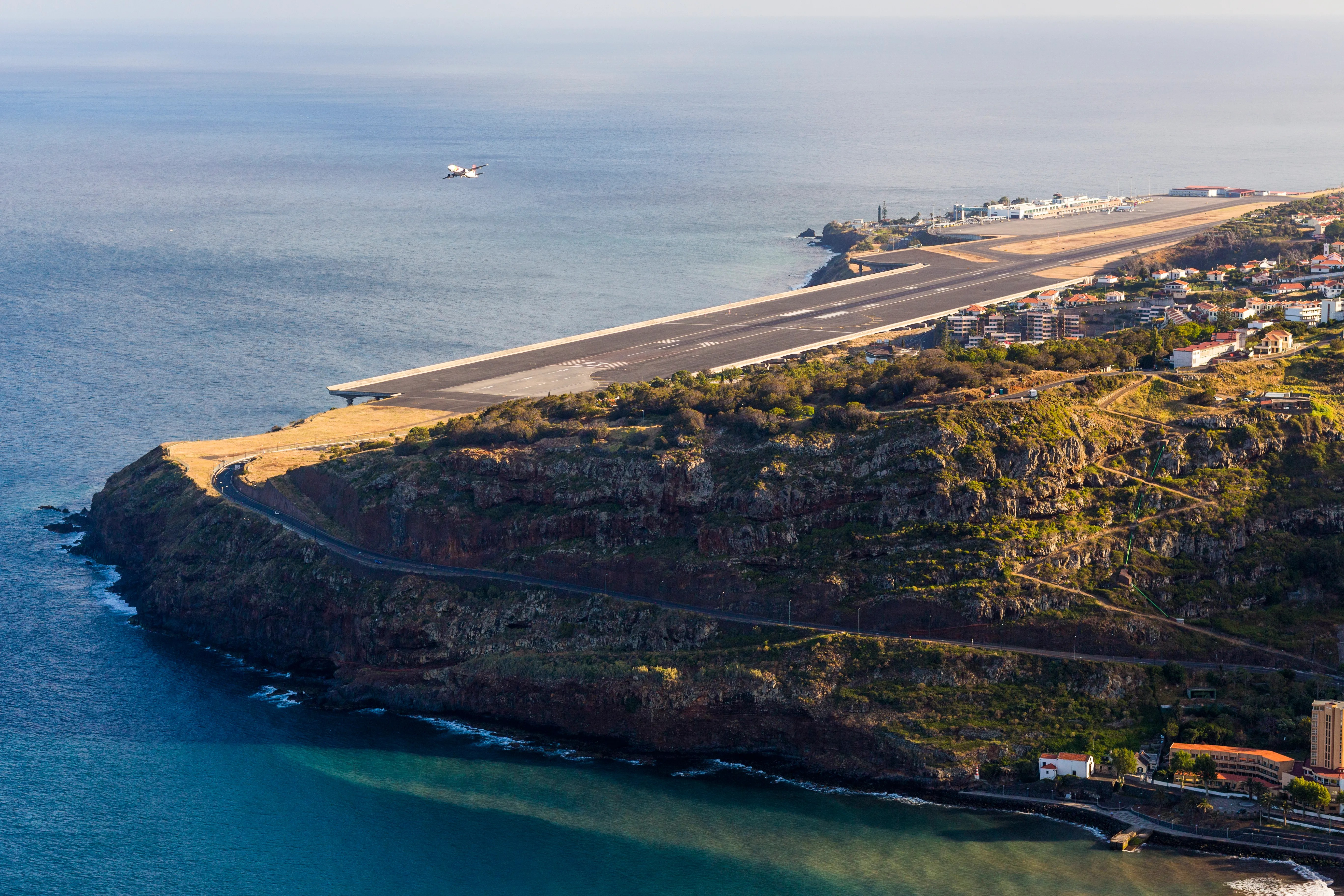 Aerial view of Madeira Airport runway built over the Atlantic ocean